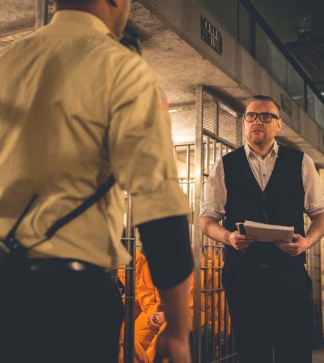 Prison warden character in the original Alcotraz interior - first prison-themed immersive cocktail bar in the UK.
