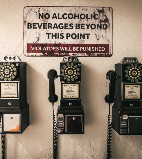 Prison phone decor in Alcotraz Brighton interior - immersive bar experience for events.