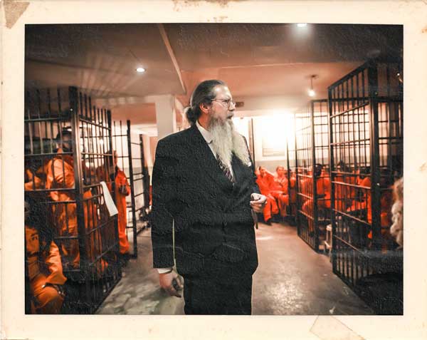 Warden character interacting with inmates at Alcotraz Brighton - authentic prison themed cocktail bar.