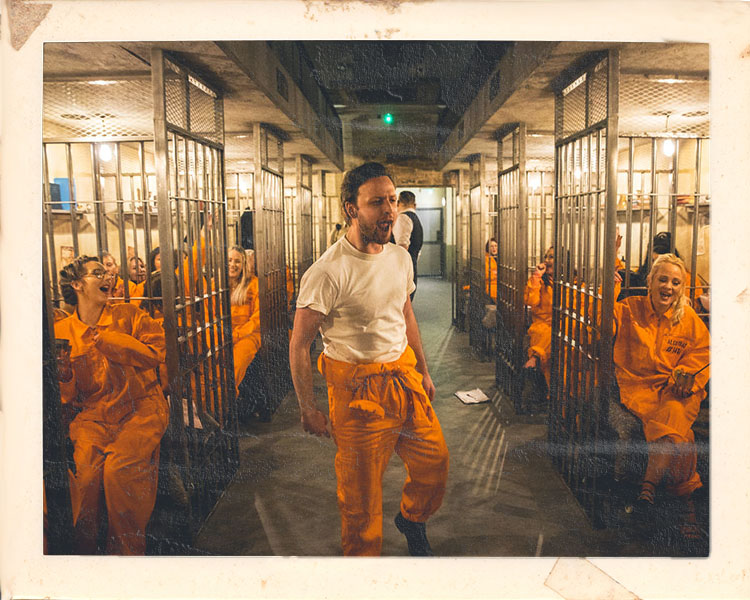 Alcotraz staff in character as prison guards - interactive team enhancing the immersive cocktail bar experience for visitors.