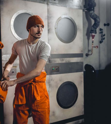 Inmate in prison cells at Alcotraz - immersive cocktail bar experience perfect for hen nights and celebrations.