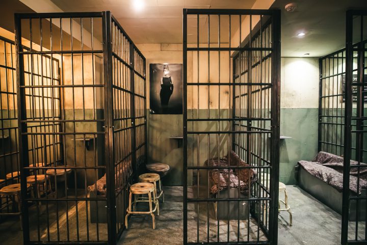 Prison cell interior at Alcotraz Brighton - interactive jail cocktail bar for fun activities and nights out.