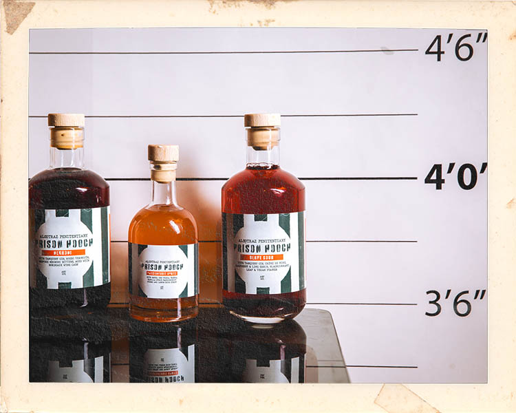 Prison hooch cocktail preparation at Alcotraz - behind the scenes of this immersive bar experience.