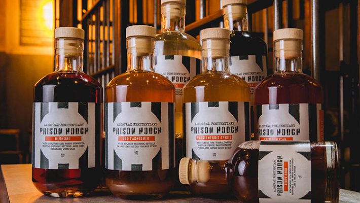 Handcrafted prison hooch cocktail bottles from Alcotraz immersive prison bar experience - perfect for enjoying at home after your visit.