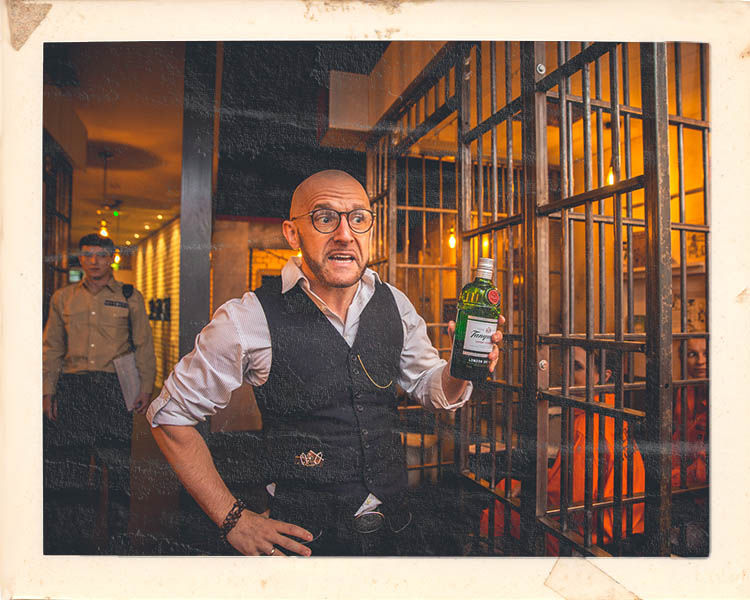 Prison warden character at Alcotraz Manchester location - immersive prison-themed cocktail bar experience.