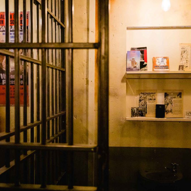 Prison cell block interior at Alcotraz - atmospheric setting for this immersive cocktail bar experience.