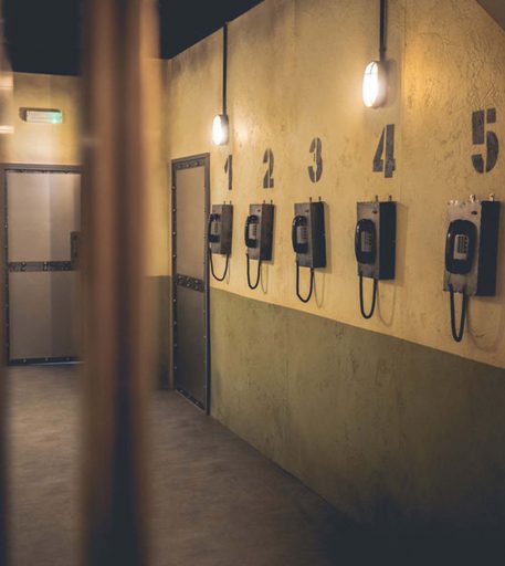 Detailed prison phone interior in the cells at Alcotraz - immersive bar experience for hen nights and celebrations.