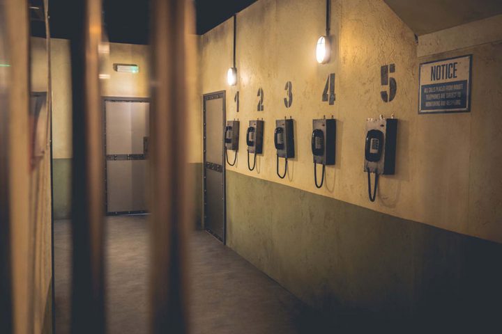 Detailed prison phone interior in the cells at Alcotraz - immersive bar experience for hen nights and celebrations.