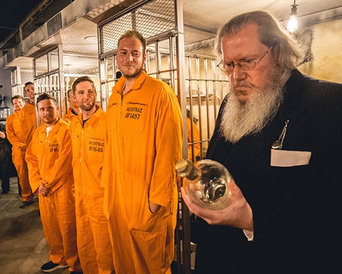 The Warden character at Alcotraz - key performer in this immersive prison-themed cocktail bar experience for interactive entertainment