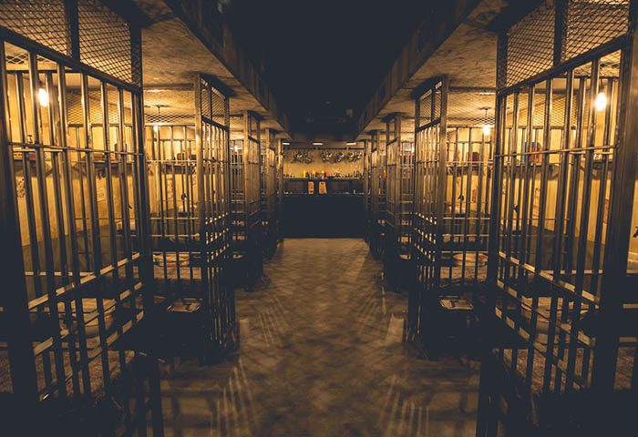 Alcotraz Liverpool venue interior - prison-themed immersive cocktail bar with realistic cell block design.