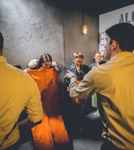 Inmates in Liverpool Alcotraz prison cell - authentic setting in this cocktail bar experience for unique date nights