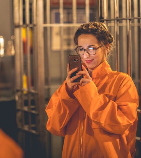 Inmate enjoying Alcotraz prison cell detail - authentic and immersive cocktail bar experience.