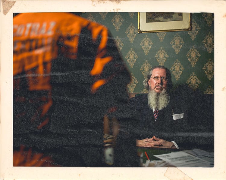 Warden character with customers at Alcotraz Bristol - prison-themed immersive cocktail bar experience for nights out.