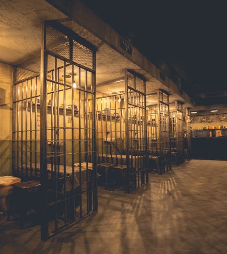 Cell block interior at Alcotraz Brighton - fun immersive prison bar experience for group nights out.