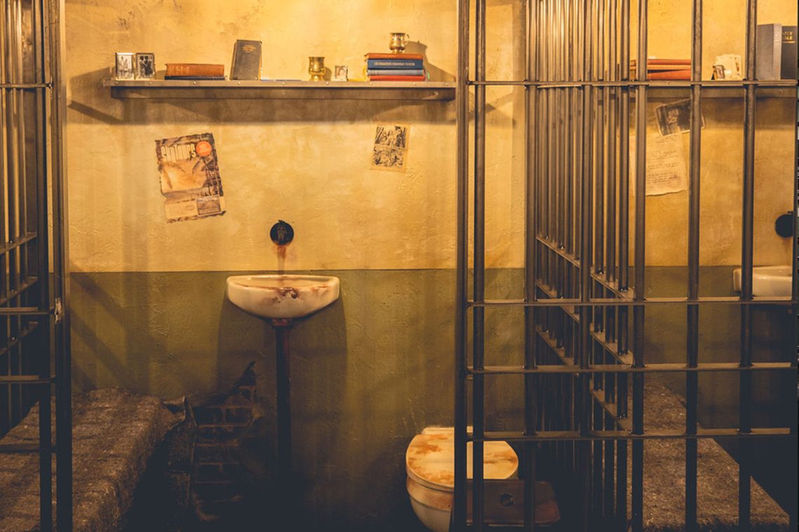 Prison cell block interior at Alcotraz - atmospheric setting for this immersive cocktail bar experience.