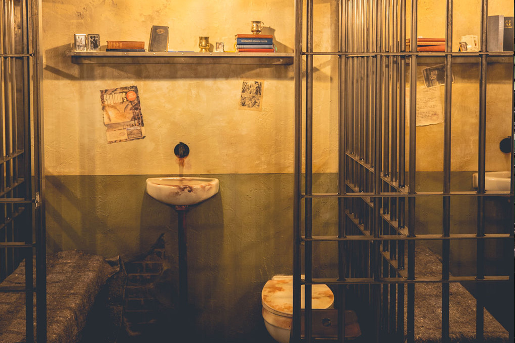 Prison cell block interior at Alcotraz - atmospheric setting for this immersive cocktail bar experience.