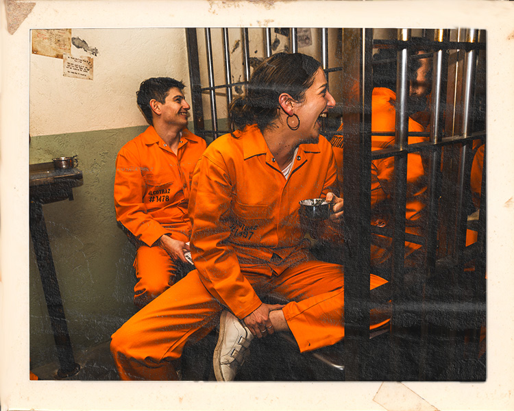 Couple on date night at Alcotraz Melbourne - romantic setting in prison-themed immersive cocktail bar experience