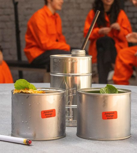 Lineup of specialty cocktails at Alcotraz - diverse drink options at this immersive prison bar experience.